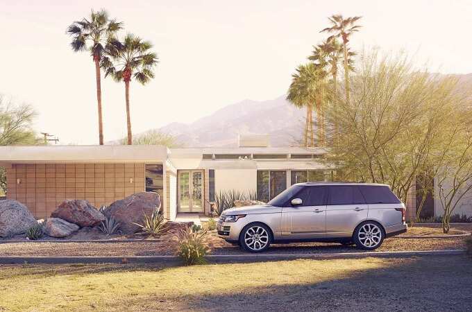 Range Rover in front of a mid-century modern home in Palm Springs.