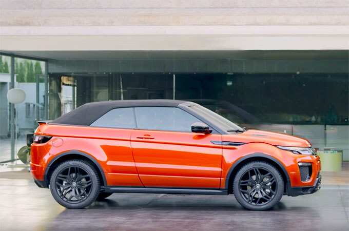 Range Rover Evoque Convertible in orange on display side view.