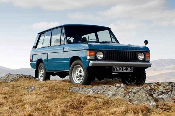 Range Rover Classic parked on top of a mountain.