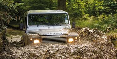 Land Rover driving through mud