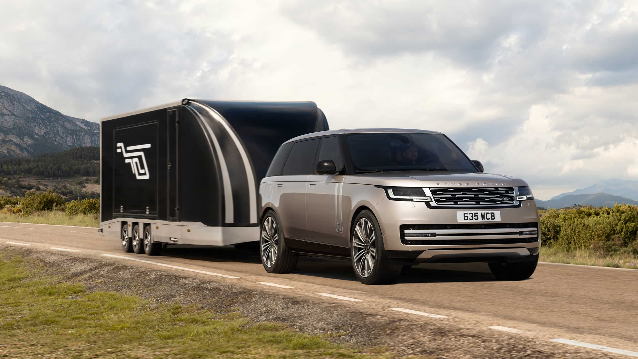 New Range Rover driving on mountain runway road