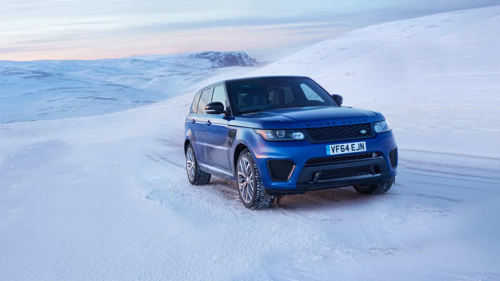 Range Rover Sport SVR driving through snowy landscape