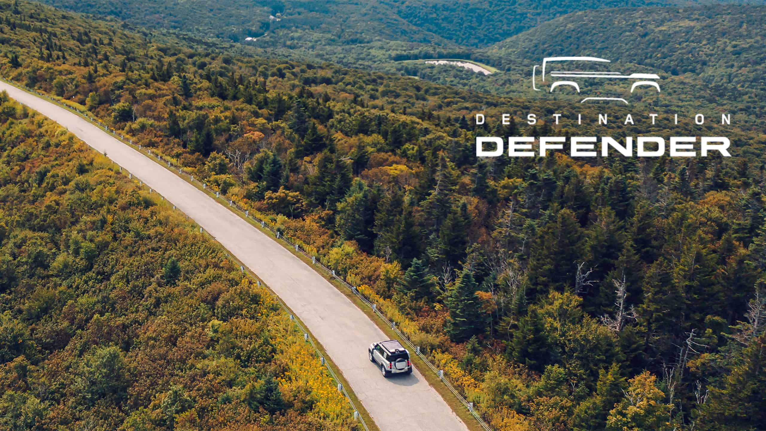 Defender on the road middle of he forest