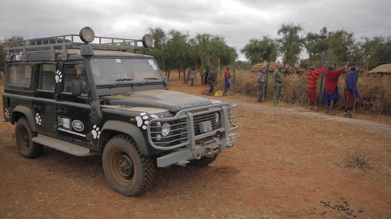 Land Rover Vehicle Parked Next to Boma Fence