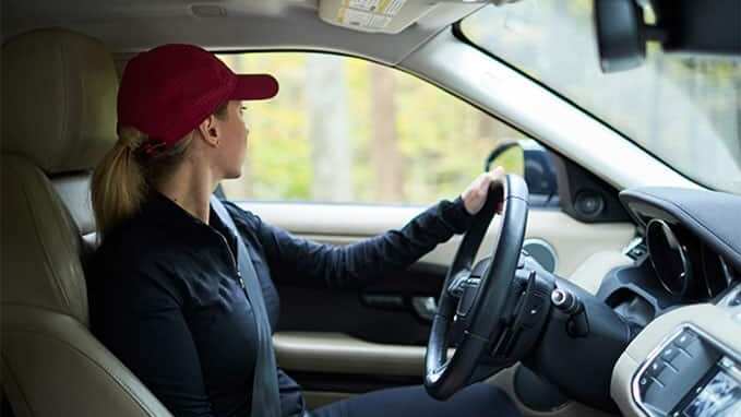 Amy Kalna driving a Range Rover Evoque
