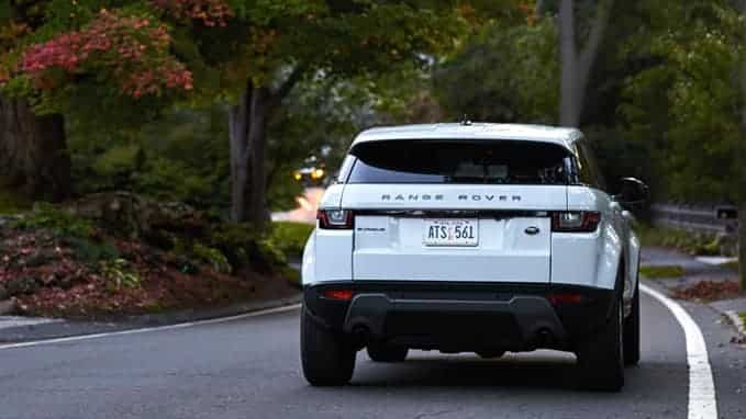 Range Rover Evoque driving down the road